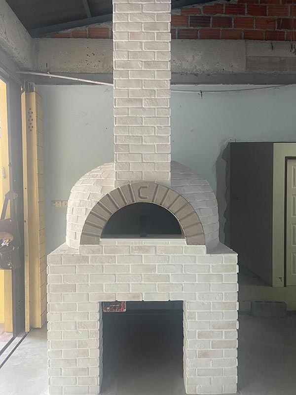Pizza oven with hidden gas system